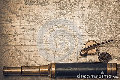 Vintage spyglass and whistle of the boatswain. Stock Photo