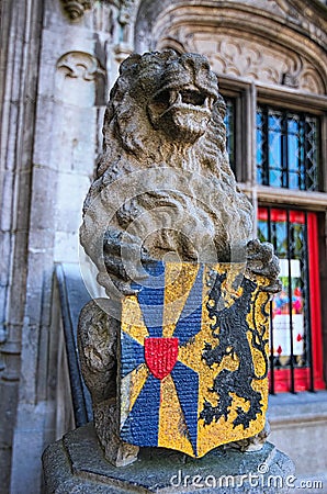Vintage statue of a Lion. Detail of Basilica of the Holy Blood in Bruges, Burg Square. Belgium Stock Photo
