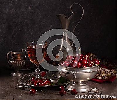 Vintage still life with ripe cherry and pewter Stock Photo