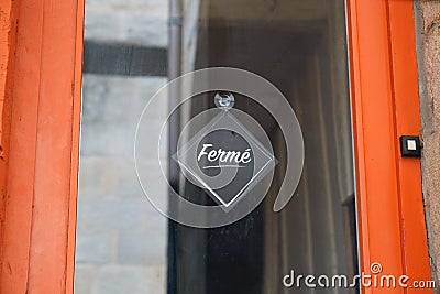 Vintage store sign fermÃ© in french text means english shop closed on door windows entrance boutique Stock Photo
