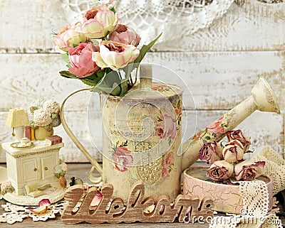 Vintage style decoration with old watering can Stock Photo