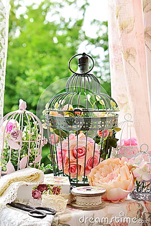 Vintage style decoration with sewing stuffs and bird cages Stock Photo