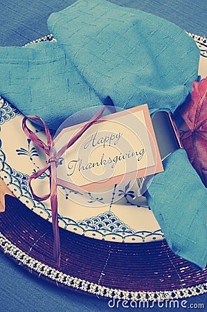 Vintage style Happy Thanksgiving dining table place setting with retro filter - closeup. Stock Photo