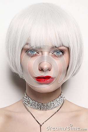 Portrait of young beautiful woman with platinum blonde hair and red lips Stock Photo