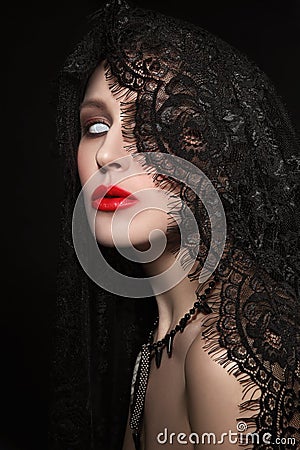 Vintage style portrait of young beautiful woman with zombie Hall Stock Photo