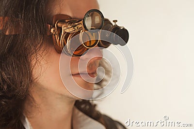 Vintage style researcher mechanist of the monocle with a large number of lenses looking at something Stock Photo