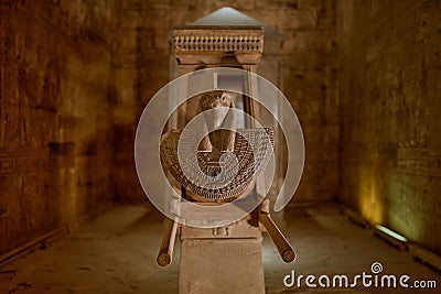 a small statue in a very old building with no doors Stock Photo