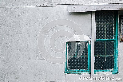 Vintage gray wall and glass window in Tai o fishing village, Hong Kong Stock Photo