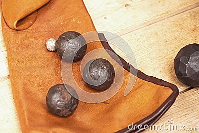 Vintage swedish cannons and metal cannonballs. Ancient military arsenal of the events of the Russian-Swedish war Stock Photo