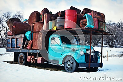 Vintage Teal Truck Holding Junk Stock Photo