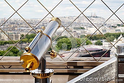 Vintage telescope looking at Paris from the Eiffel Tower Stock Photo