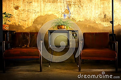 Vintage television, Antique TV, Retro technology, Old TV and old red sofa in room Stock Photo