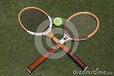 Vintage Tennis rackets and Slazenger Wimbledon Tennis Ball on grass tennis court. Editorial Stock Photo