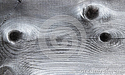 Vintage texture of natural wooden gray plank with three traces of knots. Background Stock Photo