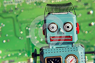 Vintage tin toy robot with computer board, artificial intelligence concept Stock Photo