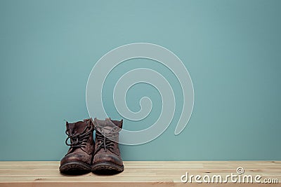 Vintage tone of Old jungle boot still life on wood background Stock Photo