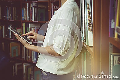 Vintage tone of Young female student with iPad tablet Stock Photo