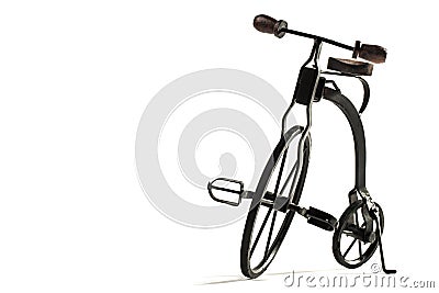 Vintage toy velocipede isolated in white Stock Photo