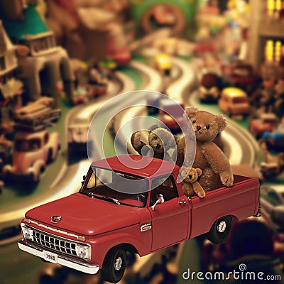 Vintage Toys - Cute teddy bears in a red car Stock Photo