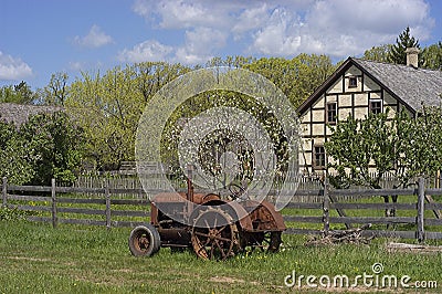 Vintage Tractor at an Old Farm Stock Photo