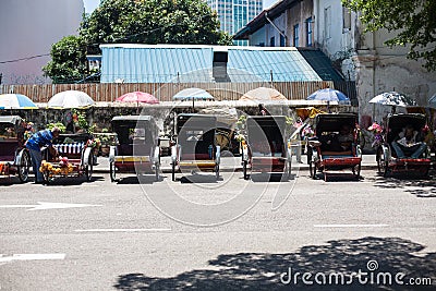 Vintage Trishaw stop beside road for service traveller Editorial Stock Photo
