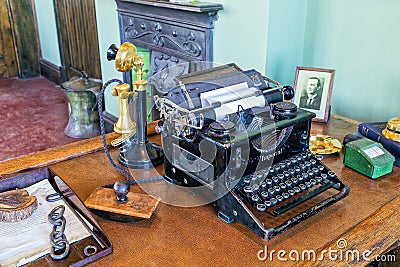 Vintage Typewriter and Candlestick Telephone. Editorial Stock Photo