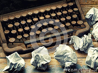 Vintage Typewriter covered desk paper balls closeup Stock Photo