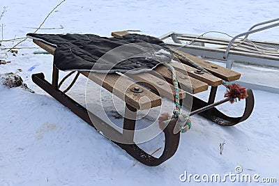 Vintage Ukrainian sled from iron and wood on the snow Stock Photo