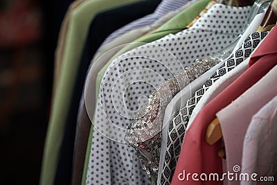 Vintage used clothes for sale inside a shop Stock Photo