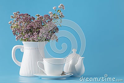 Vintage Vase with a bouquet of blossoming oregano Stock Photo