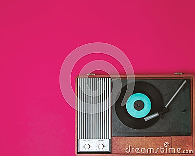 Vintage vinyl player and turnable on a fuchsia background Stock Photo