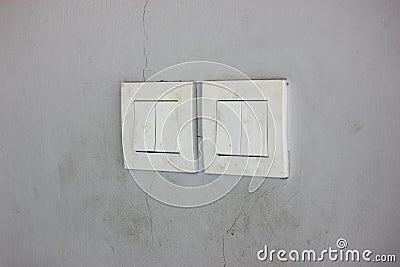 Vintage wall light switchs on cracked wall Stock Photo