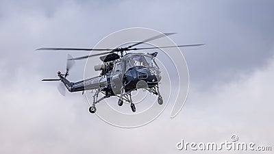A vintage Westland Wasp helicopter in flight Editorial Stock Photo