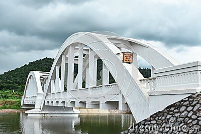 Old white arch concrete railway bridge. Stock Photo