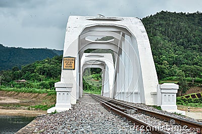 Old white arch concrete railway bridge. Stock Photo