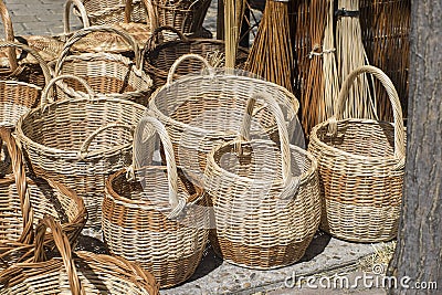 vintage wicker baskets handmade in a traditional medieval shop, Stock Photo