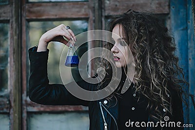 Vintage witch with elixir in hand Stock Photo