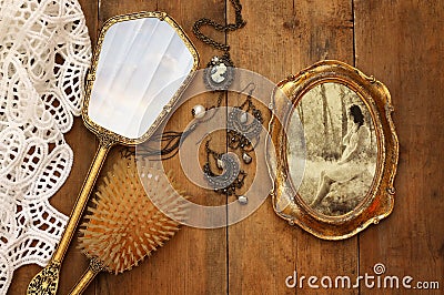 Vintage woman toilet objects next to old photography Stock Photo