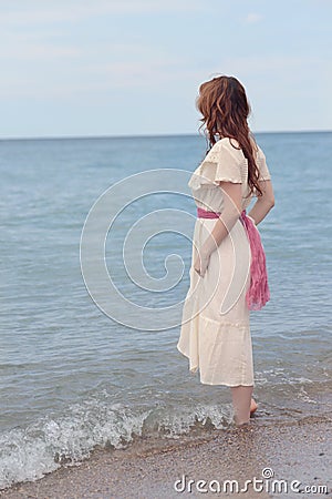 Vintage woman wadding in the sea Stock Photo