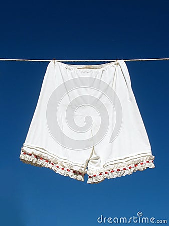 Vintage women's underwear hanging on a clothesline Stock Photo