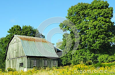 Vintage wood barn with metal gambrel roof Stock Photo