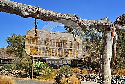 vintage wood signboard with text welcome to Monrovia. hanging on a branch Stock Photo
