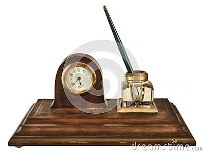 Vintage wooden inkstand with pen, glass ink pot and small clock isolated on white Stock Photo