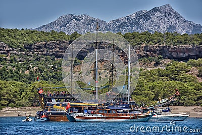 Vintage wooden pirate schooner in the open ocean against the background of the sea horizon. Tourist cruises in the Mediterranean Editorial Stock Photo