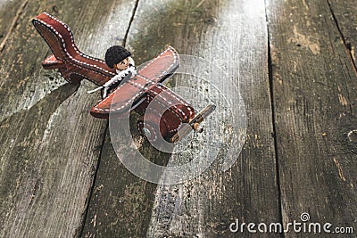 Vintage wooden plane on wooden board Stock Photo