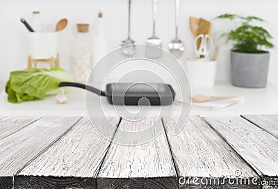 Vintage wooden planks in front of defocused kitchen counter background Stock Photo