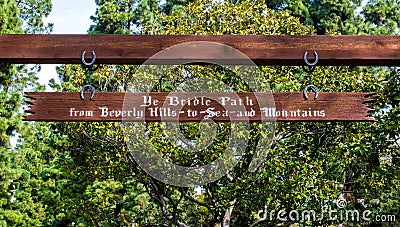 Vintage wooden sign at the Bridle path in Beverly Hills, California USA Editorial Stock Photo