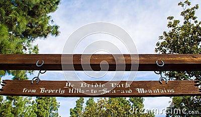 Vintage wooden sign at the Bridle path in Beverly Hills, California USA Editorial Stock Photo