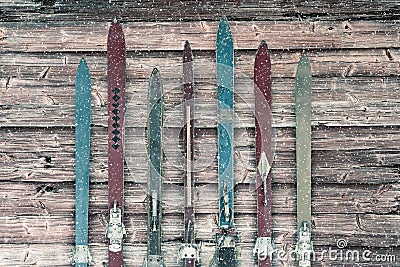 Vintage wooden weathered ski`s in winter during snow Stock Photo