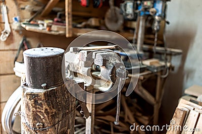 Vintage workshop with close-up of rusty bench vise Stock Photo